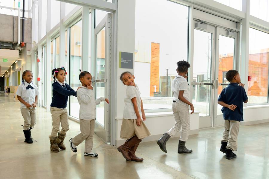 students walk down the hall of Henderson-Hopkins School